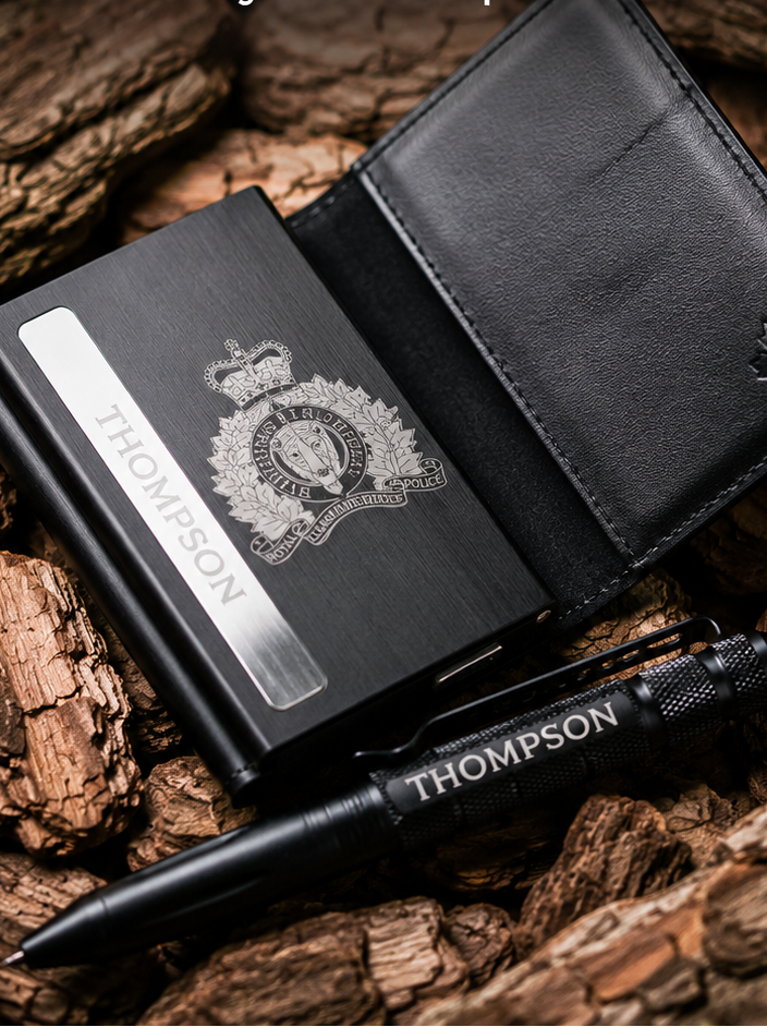 Black wallet with badge and pen on wooden surface, featuring 'Badge Boys' branding.