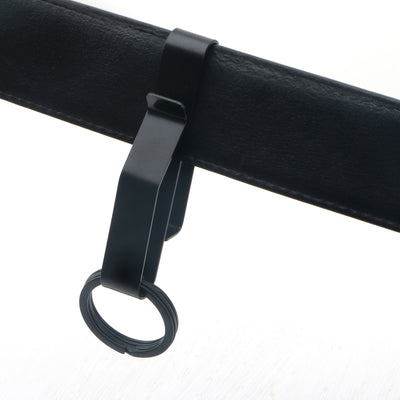 Black metal clip with ring on white background