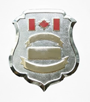 Metallic badge with a Canadian flag on a white background