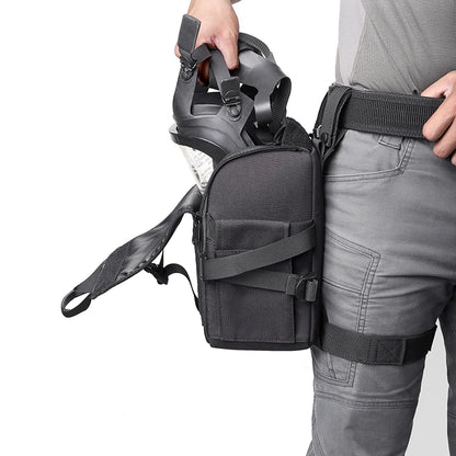 Person wearing a tactical harness with a helmet and pouches on a white background