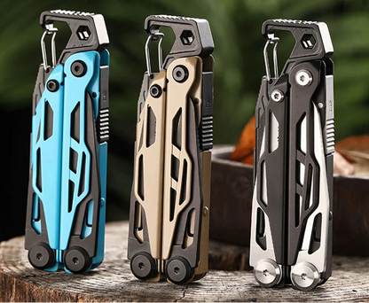 Three multi-tool keychains in blue, gold, and black on a wooden surface with a blurred natural background.