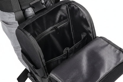 Black tactical backpack with multiple compartments and visible branding on a white background