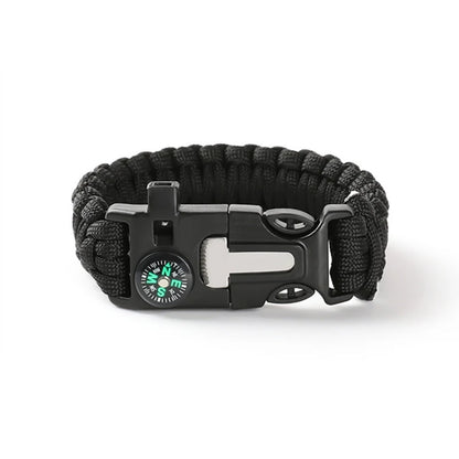Black paracord bracelet with a compass and buckle on a white background