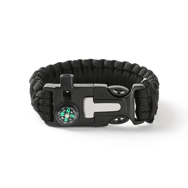 Black paracord bracelet with a compass and buckle on a white background