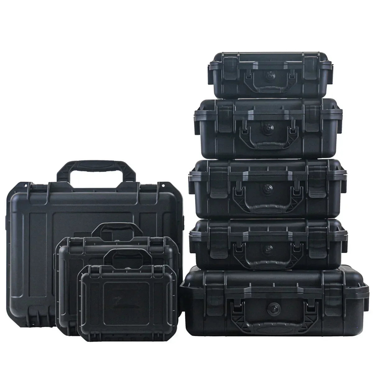 Set of black hard-shell cases of various sizes on a white background
