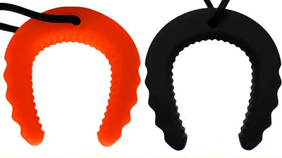 Red and black silicone lip protectors on a white background