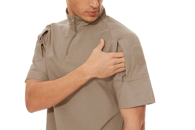 Person wearing a beige tactical shirt on a white background