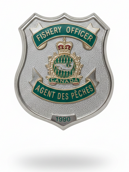 Shield-shaped badge for Fishery Officer with Canadian emblem on a white background